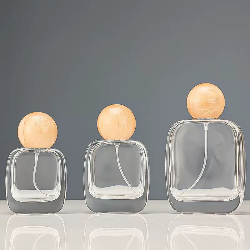 Perfume bottles with round wooden ball caps