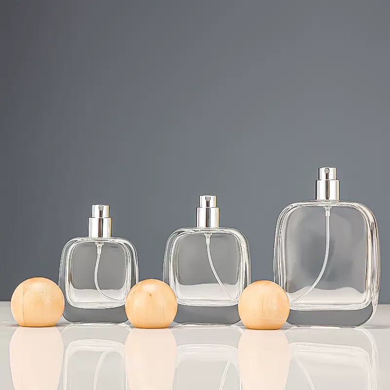 Glass bottles with wooden ball caps and spare caps